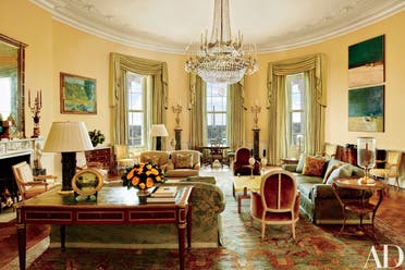 The image provided by Architectural Digest shows the Yellow Oval Room in the White House in Washington in a cover story about . Designer Michael S. Smith specified a Donald Kaufman paint for the Yellow Oval Room. Artworks by Paul Cézanne and Daniel Garber flank the mantel. Smith mellowed the Yellow Oval Room with smoky browns, greens, golds, and blues. The 1978 Camp David peace accords were signed at the antique Denis-Louis Ancellet desk, front left. President Barack Obama likes to say the White House is the “people’s house.” Architectural Digest photos are giving the public its first glimpse of private areas on the second floor of the White House that Obama, his wife, Michelle, daughters Malia and Sasha and family dogs Bo and Sunny have called home for nearly eight years. (Michael Mundy/Architectural Digest via AP)