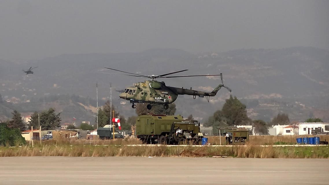 A military helicopter is seen at the Russian Hmeimim military base in Latakia province, in the northwest of Syria, on February 16, 2016. AFP