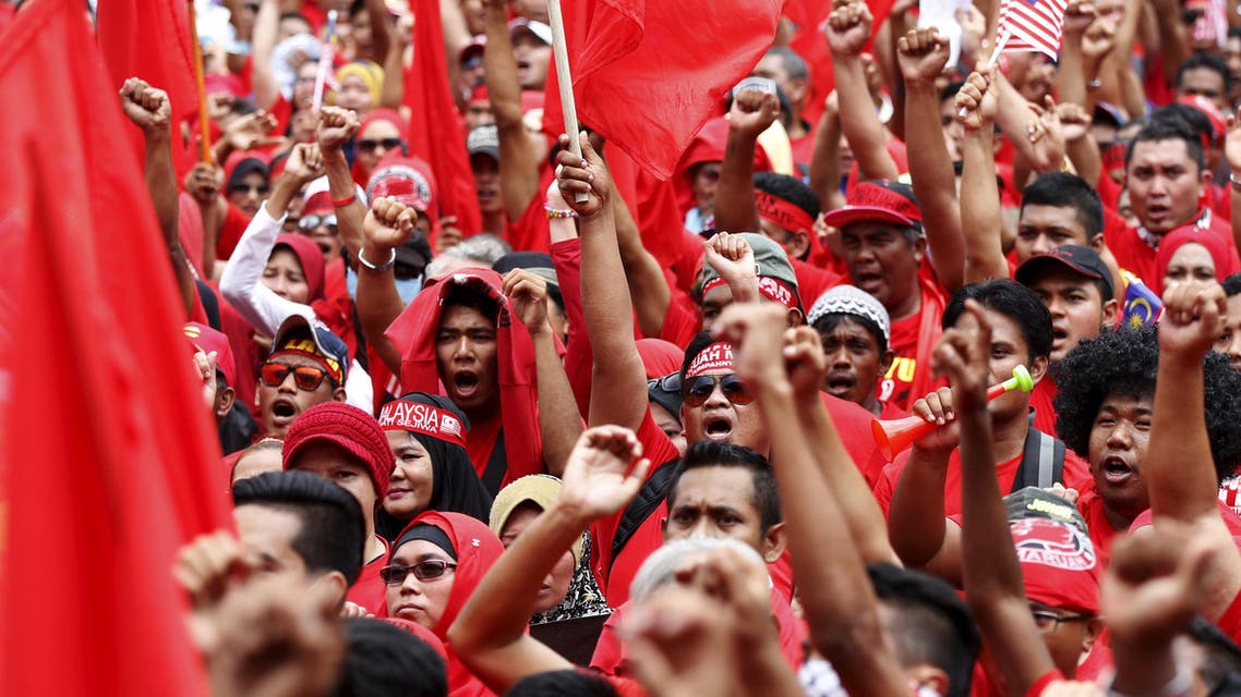 "Red Shirt" demonstrators gather for a rally to celebrate Malaysia Day and to counter a massive protest held over two days last month that called for Prime Minister Najib Razak's resignation over a graft scandal, in Malaysia's capital city of Kuala Lumpur September 16, 2015. The Malaysian government warned the Malay organisers of a mass rally getting underway in Kuala Lumpur on Wednesday to avoid racial slurs and slogans that could raise tensions in the multi-ethnic Southeast Asian nation. REUTERS
