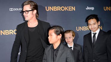 AFP Actor Brad Pitt and children Pax Jolie-Pitt (L), Shiloh Jolie-Pitt (C) and Maddox Jolie-Pitt arrive for the U.S. premiere of Universal Pictures "Unbroken," December 15, 2014 at the Dolby Theatre in Hollywood, California. AFP PHOTO / ROBYN BECK ROBYN BECK / AFP
