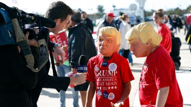 Two young Donald Trump supporters are interviewed by a television reporter before a campaing rally for Republican presidential candidate Donald Trump Saturday, Nov. 5, 2016, in Wilmington, N.C. (AP 