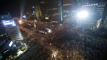 Tens of thousands of South Korean people take part in a rally calling on embattled President Park Geun-hye to resign over a growing influence-peddling scandal, in central Seoul. (Reuters)