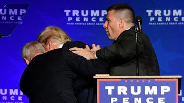 US Republican presidential nominee Donald Trump is hustled off the stage by security agents after a perceived threat in the crowd, at a campaign rally in Reno, Nevada, US Nov. 5, 2016. (Reuters)