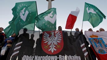 People hold flags with the Falanga symbol as they take part in the march held by far-right organizations in Warsaw, Poland September 21, 2013. Reuters