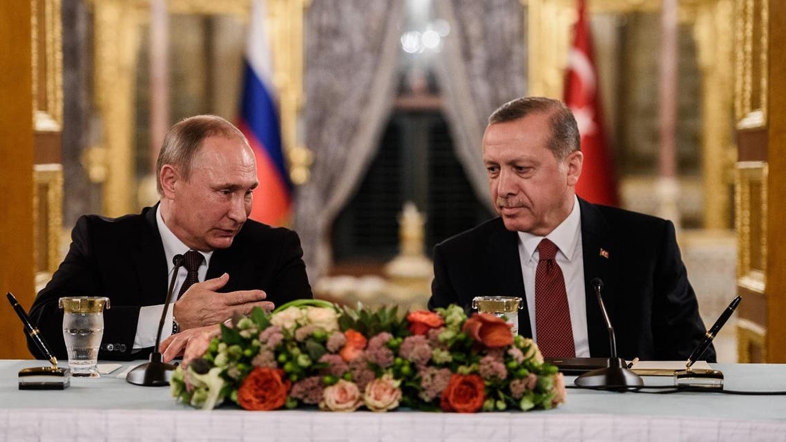 Russian President Vladimir Putin (L) speaks to Turkish President Recep Tayyip Erdogan (R) as they attend a press conference on October 10, 2016 in Istanbul. Putin visits Turkey on October 10 for talks with counterpart Recep Tayyip Erdogan, pushing forward ambitious joint energy projects as the two sides try to overcome a crisis in ties. OZAN KOSE / AFP