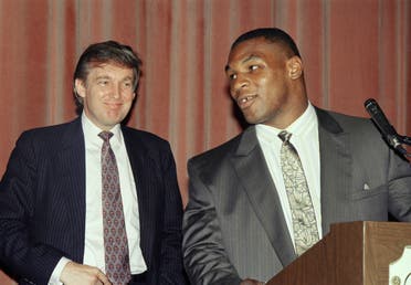 In this July 27, 1988, file photo, heavyweight champion Mike Tyson, right, speak at a news conference while adviser Donald Trump listens in New York, after announcing a settlement between Tyson and his manager, Bill Cayton. (AP)