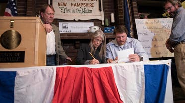 Clerks tabulate ballots at a polling station just after midnight on November 8, 2016 in Dixville Notch, New Hampshire, the first voting to take place in the 2016 US presidential election. (AFP)