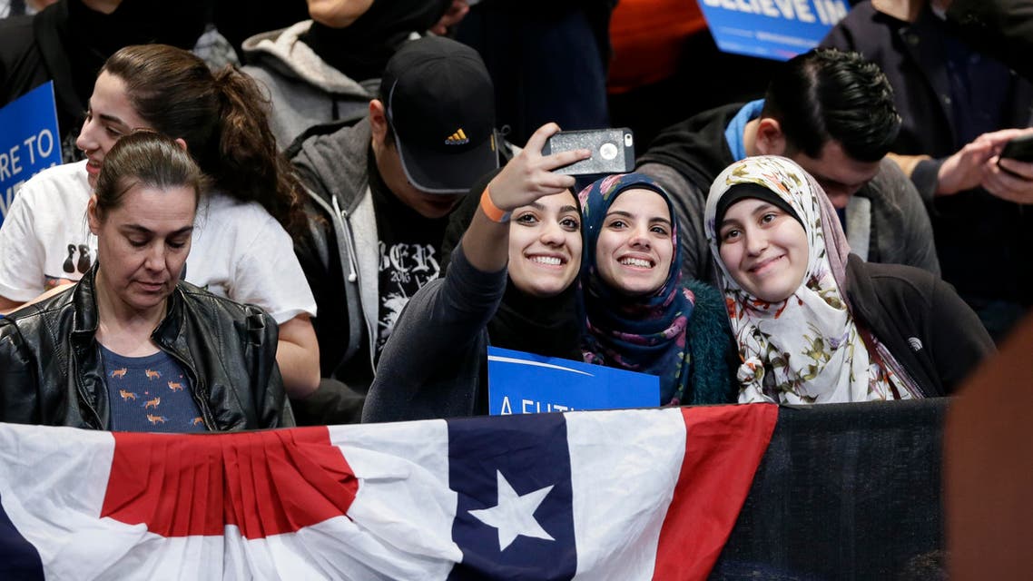 Audience members wait for Democratic presidential candidate, Sen. Bernie Sanders, I-Vt., to speak at a campaign rally, Monday, March 7, 2016, in Dearborn, Mich. (AP)