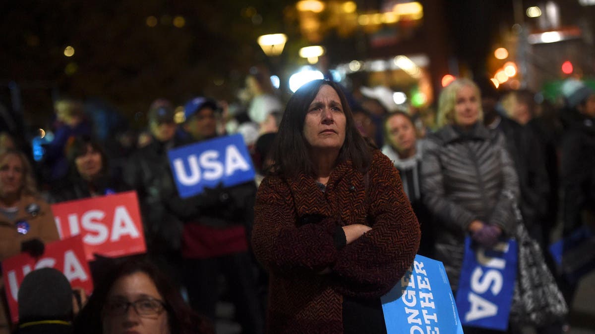 US elections Hillary Clinton supporters listen to the U.S. Democratic presidential candidate during her final rally at Independence Hall on the eve of election day in Philadelphia, Pennsylvania November 7, 2016. (Reuters)