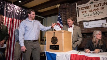 A man casts his ballot inside a polling station just after midnight on November 8, 2016 in Dixville Notch, New Hampshire, the first voting to take place in the 2016 US presidential election. (AFP)