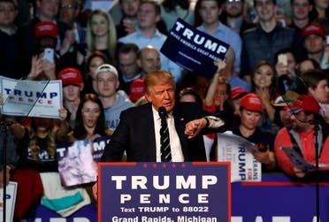 “Just imagine what our country could accomplish if we started working together as one people, under one God, saluting one American flag,” Trump told supporters. (AFP)