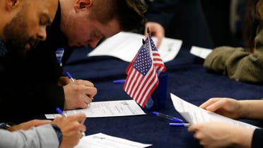 Voters fill out their ballot paper in London, Tuesday, March 1, 2016 as voting begins in the U.S. Democrats Abroad Global Presidential Primary.(AP)