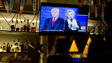In this file photo dated Sunday, Oct. 9, 2016, The second U.S. presidential debate between Republican presidential candidate Donald Trump, left, and Democratic presidential candidate Hillary Clinton is shown on a TV screen at a restaurant in Mexico City. AP