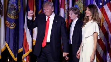 President-elect Donald Trump pumps his fist after giving his acceptance speech as his wife Melania Trump, right, and their son Barron Trump follow him during his election night rally, Wednesday, Nov. 9, 2016, in New York. AP