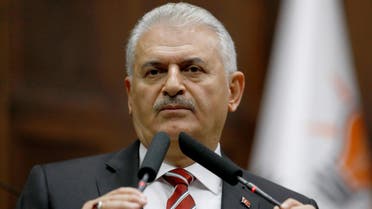 Turkey's Prime Minister Binali Yildirim addresses members of parliament from his ruling AK Party (AKP) during a meeting at the Turkish parliament in Ankara, Turkey, November 8, 2016.  reuters