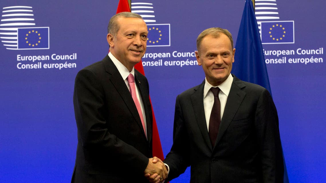 Turkish President Recep Tayyip Erdogan, left, is greeted by European Council President Donald Tusk prior to a meeting at the EU Council building in Brussels on Monday, Oct. 5, 2015. AP
