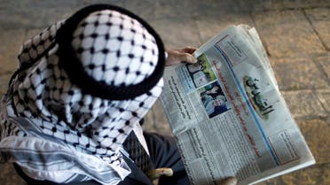 A Palestinian man reads the Al-Quds newspaper depicting images newly elected U.S. President Donald Trump and Democratic presidential nominee Hillary Clinton in Jerusalem's Old City November 9, 2016. reuters