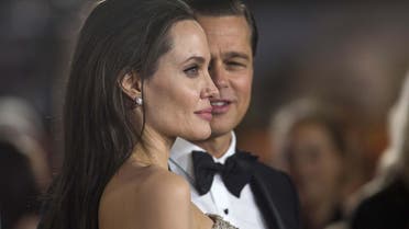 Angelina Jolie and Brad Pitt pose at the premiere of "By the Sea" during the opening night of AFI FEST 2015 in Hollywood, California, U.S., Nov. 5, 2015. (Reuters) 
