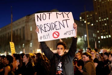 A demonstrator holds a sign during a protest in San Francisco, California, US following the election of Donald Trump as the president of the United States November 9, 2016. (Reuters)