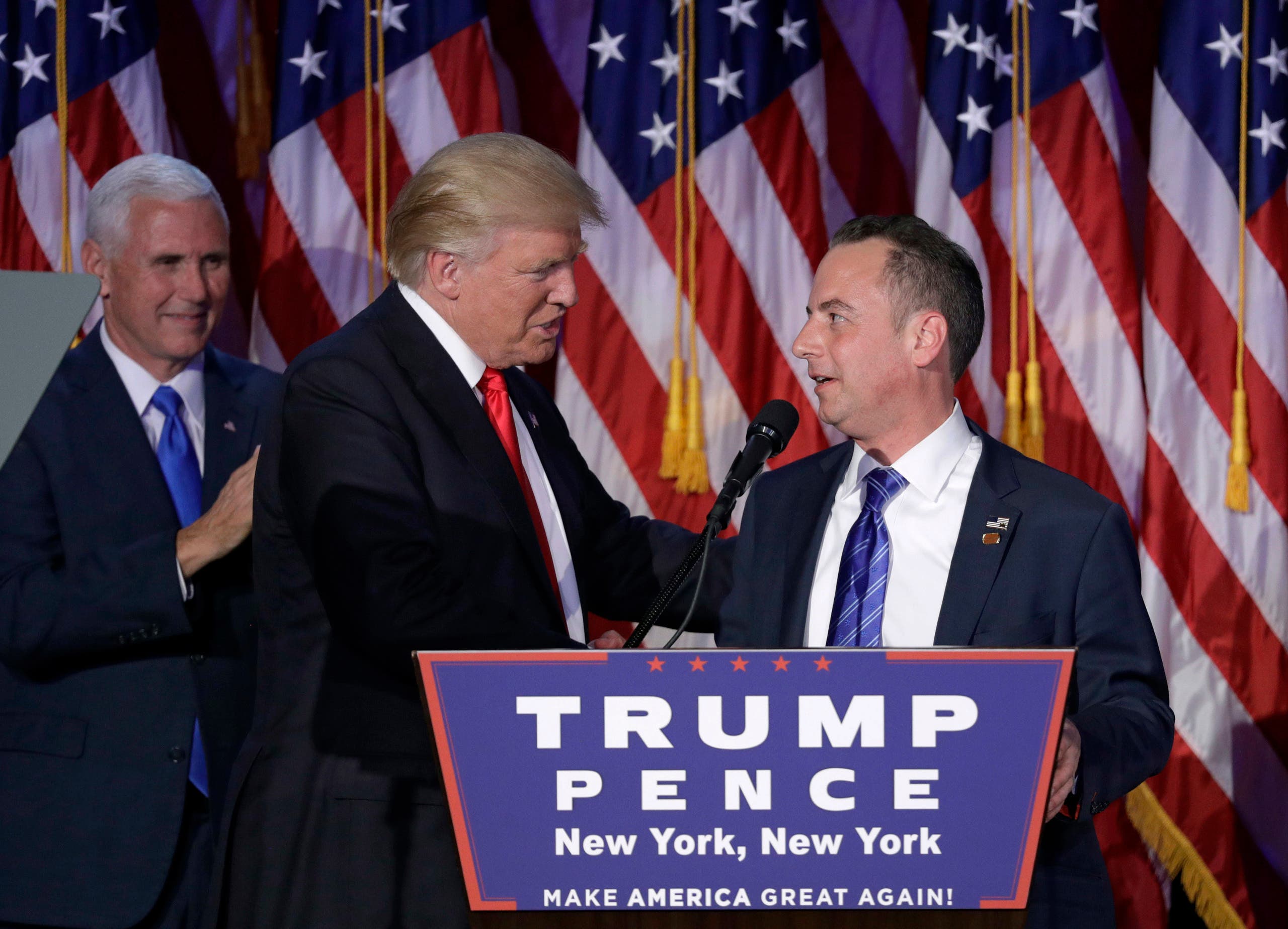 In this Wednesday, Nov. 9, 2016, file photo, President-elect Donald Trump, center, shakes hands with Republican National Committee Chairman Reince Priebus during an election night rally in New York. Trump on Sunday named Priebus as his White House chief of staff. (AP)