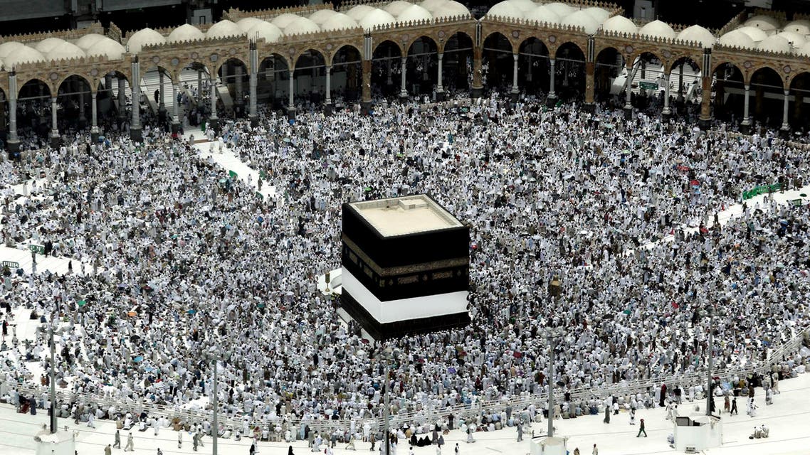 Muslim pilgrims prepare themselves for Friday prayers in front of the Kaaba, Islam's holiest shrine, at the Grand Mosque in the Muslim holy city of Mecca, Saudi Arabia, Friday, Sept. 9, 2016. (AP)