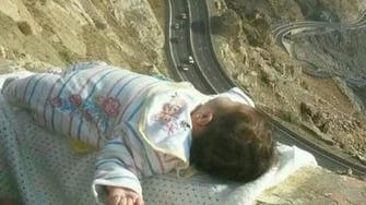 Saudi baby photo on mountain edge sparks outrage