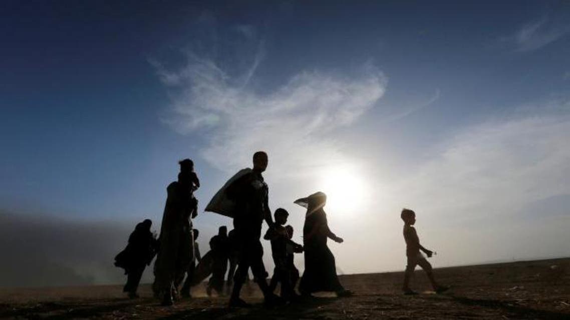 Civilians return to their village after it was liberated from ISIS militants, south of Mosul on October 21, 2016. (Reuters)