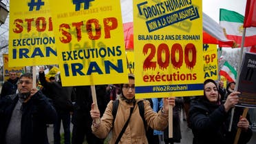 Supporters of Maryam Rajavi, President of the National Council of Resistance of Iran, demonstrate against the Iranian President Hassan Rouhani's visit in Paris, Wednesday, Jan. 27, 2016. (AP)