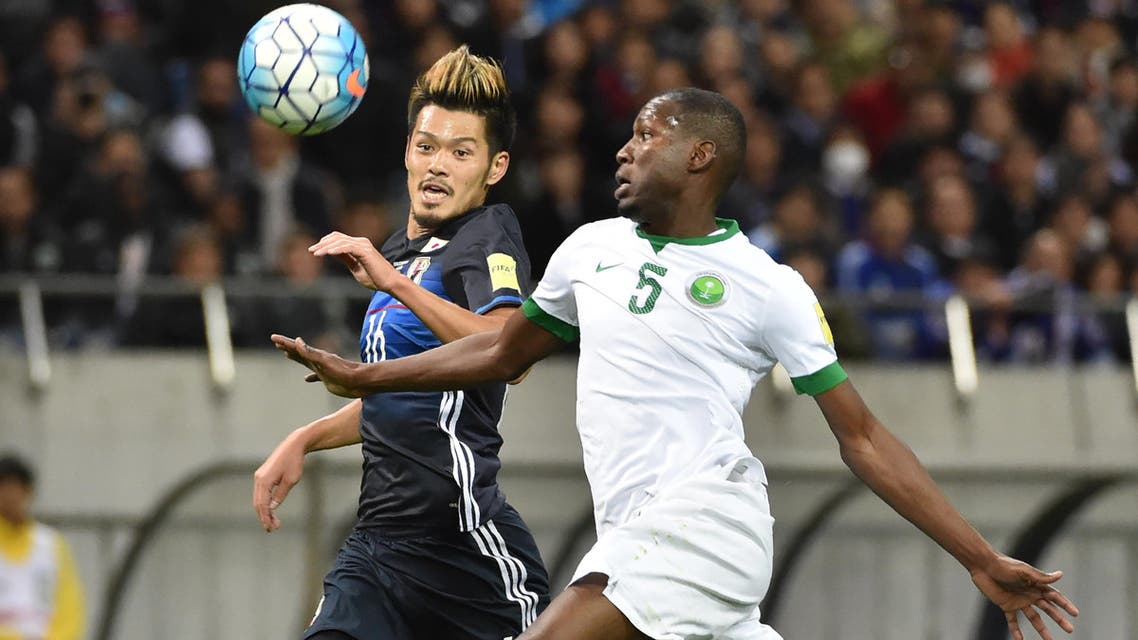 Japan's midfielder Hotaru Yamaguchi (L) and Saudi Arabia's defender Omar Ibrahim Othman (R) fight for the ball during their football match in Group B of the 2018 World Cup Asian qualifier at Saitama Stadium in Saitama on November 15, 2016. KAZUHIRO NOGI / AFP