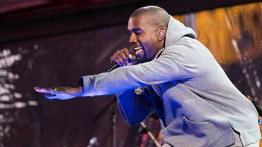 Kanye West performs during the World AIDS Day (RED) concert In Times Square on Monday, Dec. 1, 2014 in New York. (Photo by Charles Sykes/Invision/AP)