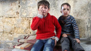 Injured boys react at a field hospital after airstrikes on the rebel held areas of Aleppo, Syria November 18, 2016. (Reuters) 