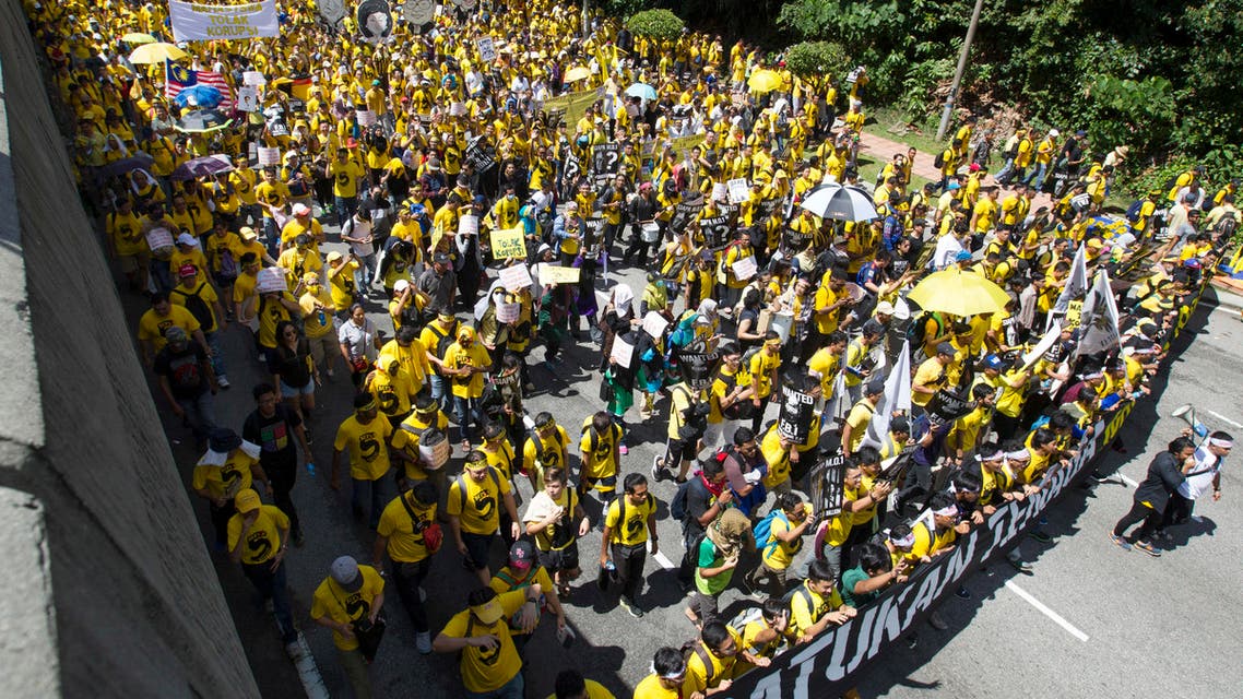 Activists from the Coalition for Clean and Fair Elections (Bersih), march during a rally in Kuala Lumpur, Malaysia, on Saturday, Nov. 19, 2016. Malaysian police detained 12 activists and tightened security ahead of the rally by electoral reform group Bersih seeking Prime Minister Najib Razak’s resignation over a financial scandal.  (AP)