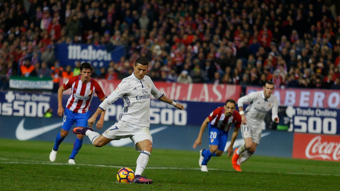 Real Madrid's Cristiano Ronaldo shoots a penalty kick to score his side's second goal against Atletico Madrid during a Spanish La Liga soccer match between Real Madrid and Atletico Madrid at the Vicente Calderon stadium in Madrid, Saturday, Nov. 19, 2016. Ronaldo scored a hat trick in Real Madrid 3-0 victory. (AP)