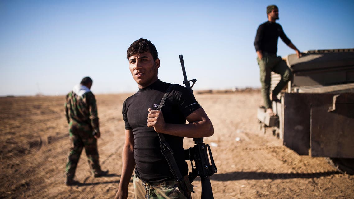 Members of the Hashd Al Shaabi (Popular Mobilisation Units) are seen on their way to Tal Afar airport on November 20, 2016. Pro-government paramilitary forces advancing on the town of Tal Afar, which commands the city's western approaches, entered its airport, while troops moving up from the south had the Mosul airport in their sights. Achilleas Zavallis / AFP
