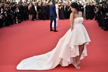 French actress Leila Bekhti poses as she arrives for the opening ceremony of the 68th Cannes Film Festival in Cannes, southeastern France, on May 13, 2015. AFP 