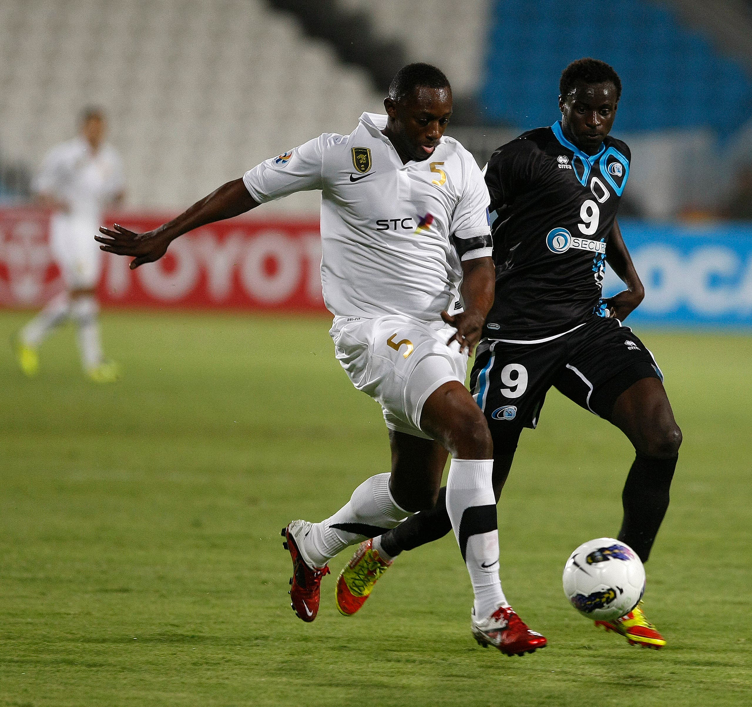 UAE's Baniyas club player Andre Senghor (R) fights for the ball with Saudi Arabia's Al-Ittihad club player Osama Harbi (L) during their Group B, AFC Champions League football match in Abu Dhabi on April 17, 2012. AFP