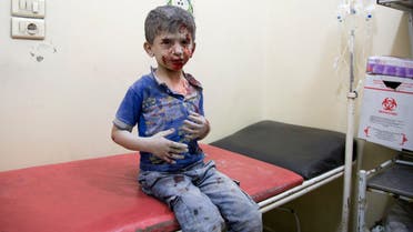 A Syrian boy receives treatment at a make-shift hospital following air strikes on rebel-held eastern areas of Aleppo on September 24, 2016. Heavy Syrian and Russian air strikes on rebel-held eastern areas of Aleppo city killed at least 25 civilians on Saturday, the Britain-based Syrian Observatory for Human Rights said, overwhelming doctors and rescue workers.  KARAM AL-MASRI / AFP