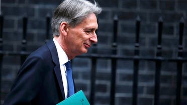 Britain's Chancellor of the Exchequer Philip Hammond leaves 11 Downing Street on his way to present his Autumn Statement in the House of Commons, in London on November 23, 2016. (Reuters)
