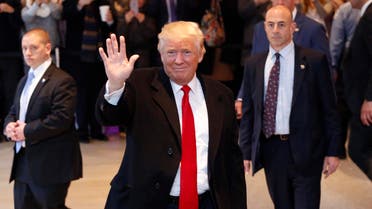 President-elect Donald Trump waves to the crowd as he leaves the New York Times building following a meeting, Tuesday, Nov. 22, 2016, in New York. (AP)