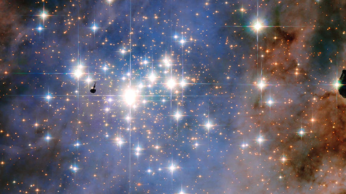 This handout picture released by NASA ESA Hubble Space Telescope on January 21, 2016 features the star cluster Trumpler 14 One of the largest gatherings of hot massive and bright stars in the Milky Way th