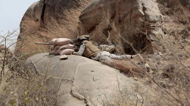 In this Monday, April 20, 2015 file photo, a Saudi soldier aims machine-gun from behind sandbag barricade in the border with Yemen in Jazan, Saudi Arabia. AP