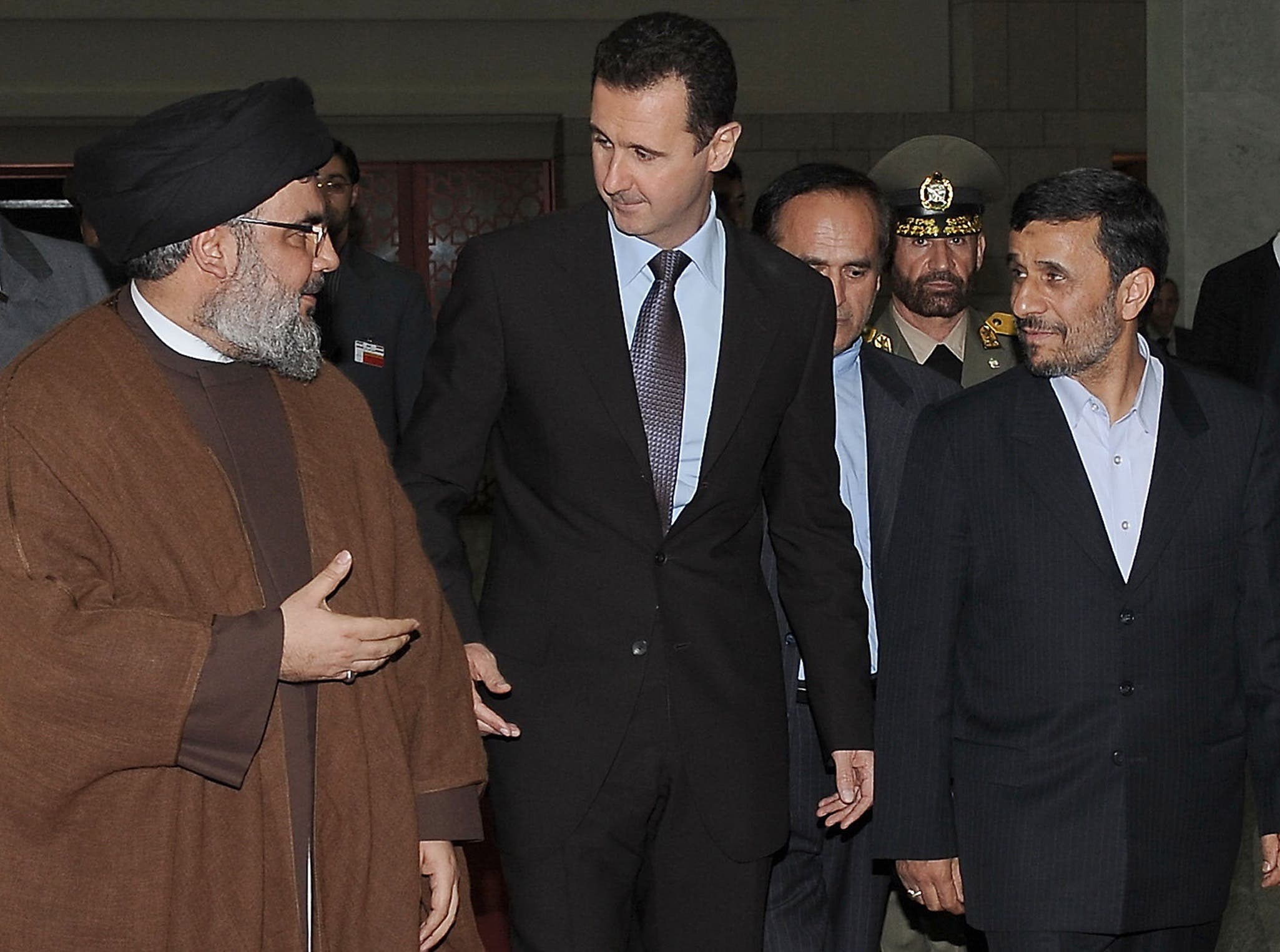 Lebanon's Hezbollah chief Hassan Nasrallah, Syrian President Bashar al-Assad and his Iranian counterpart Mahmoud Ahmadinejad arriving for an official dinner in Damascus on February 25, 2010. (AFP)