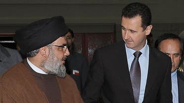 A handout picture released by the Syrian Arab News Agency (SANA) shows (L-R) Lebanon's Hezbollah chief Hassan Nasrallah, Syrian President Bashar al-Assad and his Iranian counterpart Mahmoud Ahmadinejad arriving for an official dinner in Damascus late on February 25, 2010. The presidents of Syria and Iran have signed a visa-scrapping accord, signalling even closer ties and brushing aside US efforts to drive a wedge between the two allies. AFP PHOTO/HO/SANA == RESTRICTED TO EDITORIAL USE == SANA / AFP
