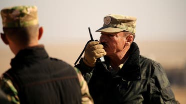 Nineveh Operations Commander Major General Najm al-Jubbouri uses a handheld radio during an operation against Islamic State militants southeast of Mosul, Iraq November 26, 2016. Picture taken November 26, 2016. REUTERS