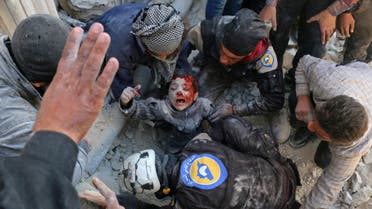 Syrian civil defence volunteers, known as the White Helmets, rescue a boy from the rubble following a reported barrel bomb attack on the Bab al-Nairab neighbourhood of the northern Syrian city of Aleppo on November 24, 2016. (AFP)