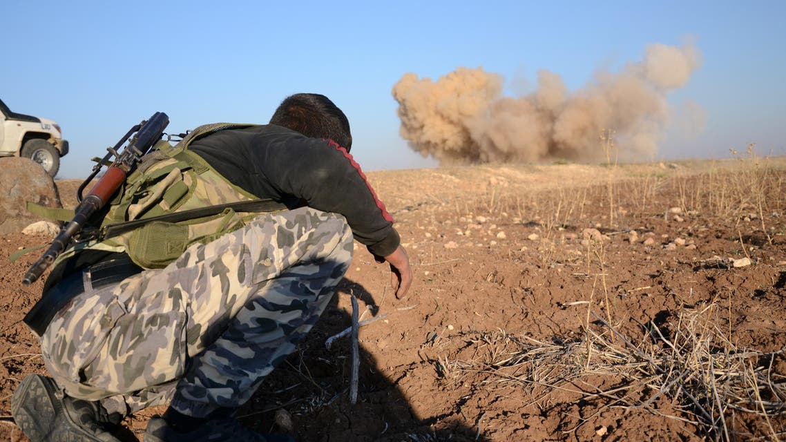 A rebel fighter reacts as a landmine, planted by Islamic State (IS) group jihadists, is exploded by his comrades in the village of Tilalayn on the western outskirts of the northern Syrian town of Dabiq, on November 25, 2016. Nazeer al-Khatib / AFP