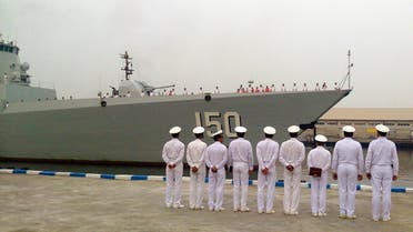 A handout photo provided by the Iranian news agency IRNA shows Iran's Navy officers lining up to welcome the Chinese Navy destroyer as it makes a landfall at the Iranian port of Bandar Abbas on the Gulf on September 20, 2014. (AFP)