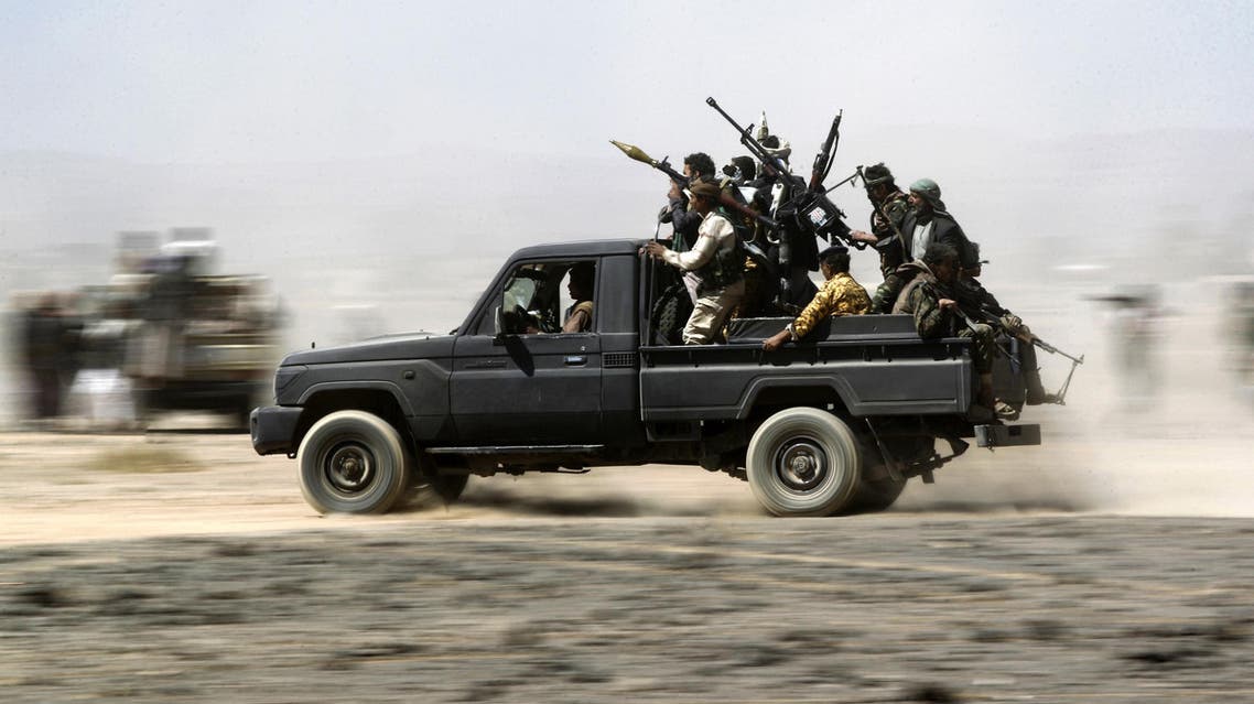 Armed Yemeni tribesmen loyal to the Shiite Huthi rebels sit in the back of an armed vehicle during a gathering to mobilise more fighters into several battlefronts on November 1, 2016 on the outskirts of the capital Sanaa. The war in Yemen escalated in March 2015 when the Saudi-led coalition launched a military campaign to push back the Huthi rebels, after they seized the capital in 2014 and then advanced on other parts of Yemen. MOHAMMED HUWAIS / AFP