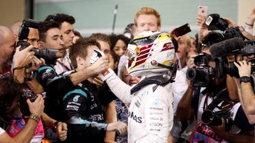 Mercedes' Formula One driver Lewis Hamilton of Britain celebrates after winning the race. REUTERS