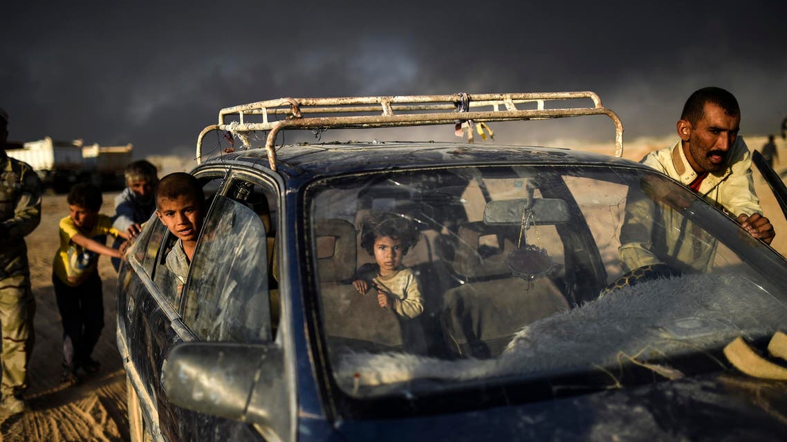 Displaced Iraqis arrive at refugee camp on October 22, 2016 in the town of Qayyarah, south of Mosul, as an operation to recapture the city of Mosul from the Islamic State group takes place. Iraqi security forces battled for a second day with Islamic State group gunmen who infiltrated Kirkuk in a brazen raid that rattled Iraq as it ramped up an offensive to retake Mosul. BULENT KILIC / AFP